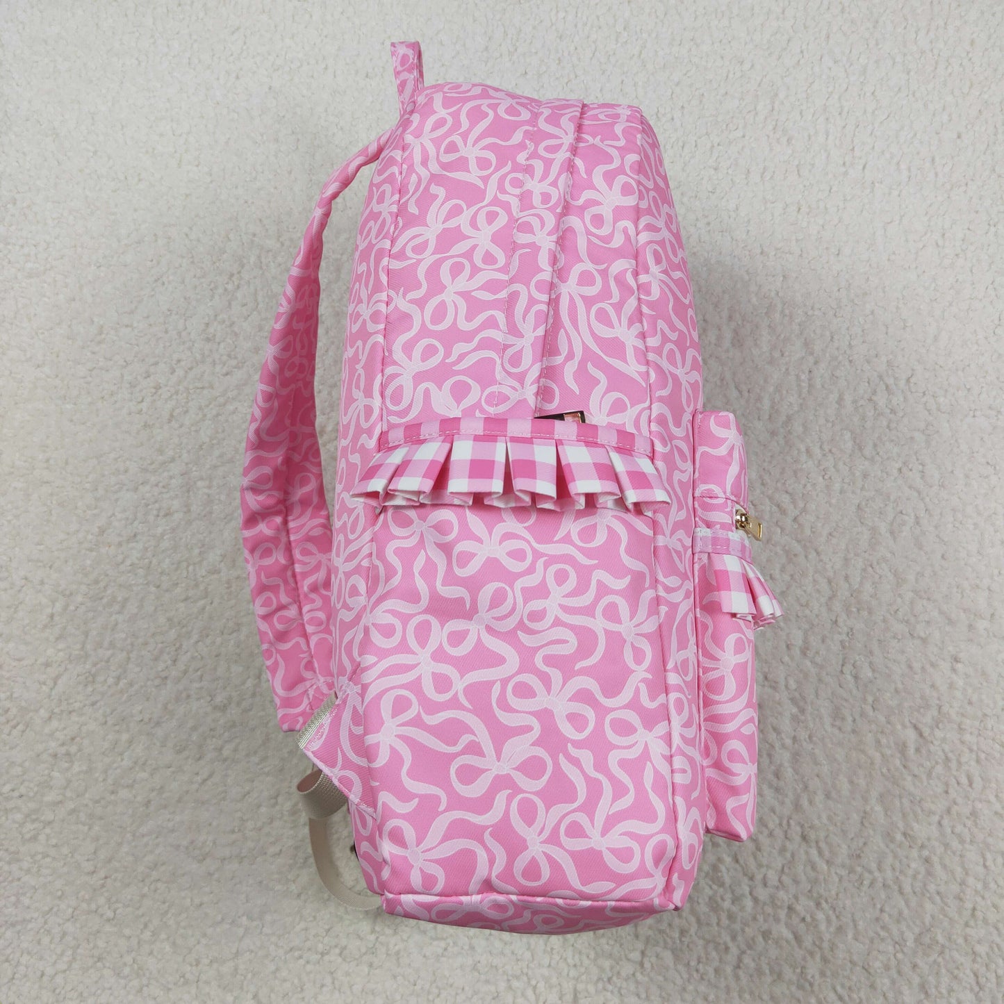 white bow on pink print kids backpack