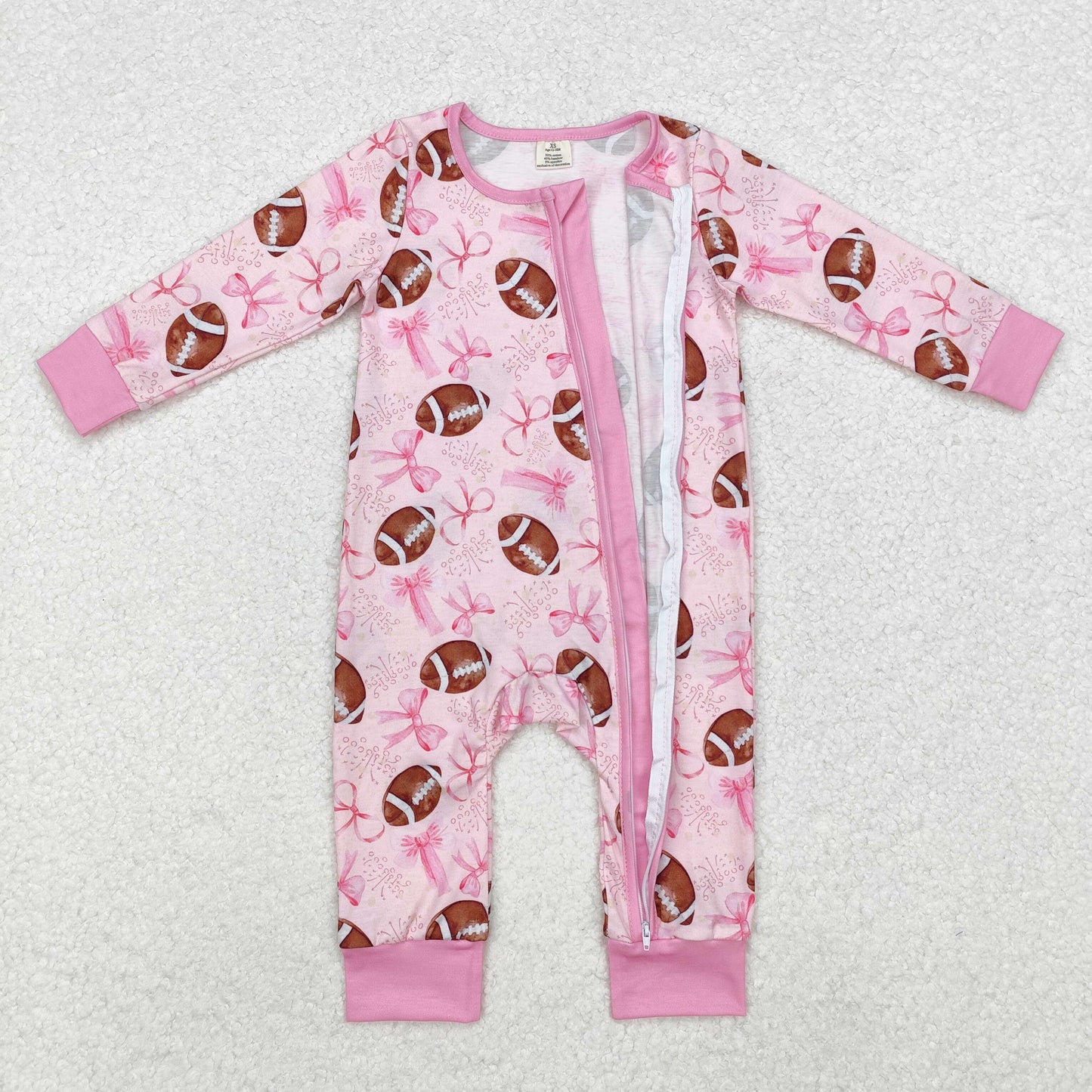 pink bows and football print zip bamboo sleeper