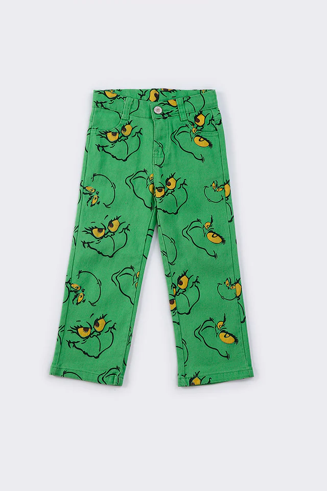 green grinchey print denim jeans