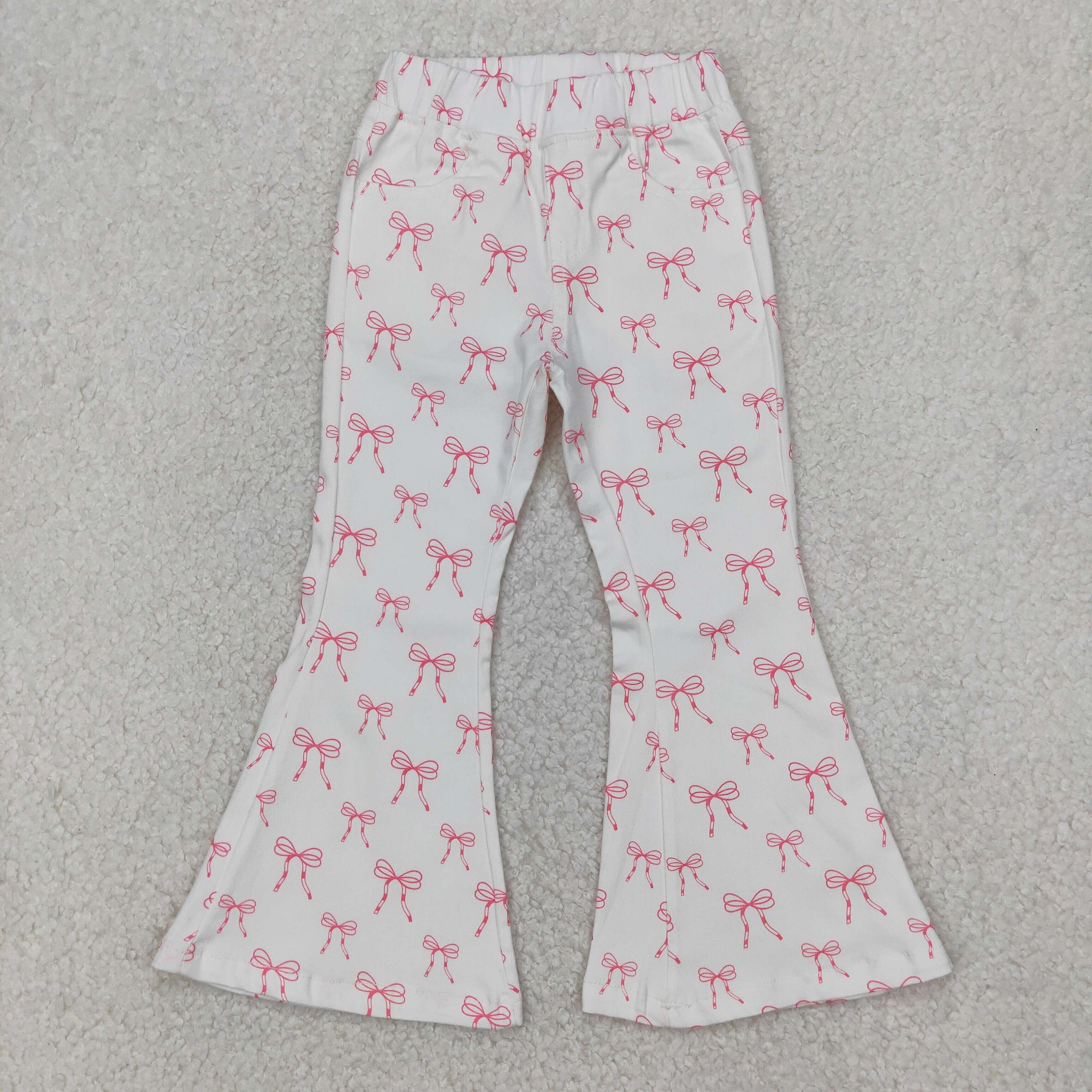 pink bow on white girl jeans