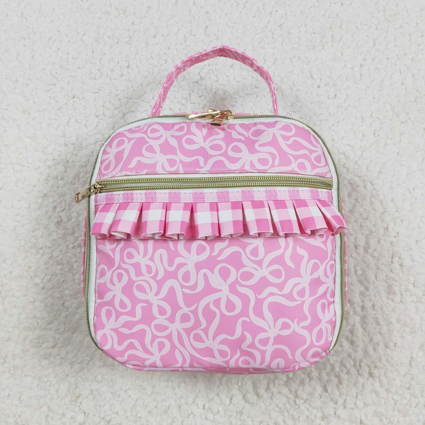 white bow on pink kids lunch box