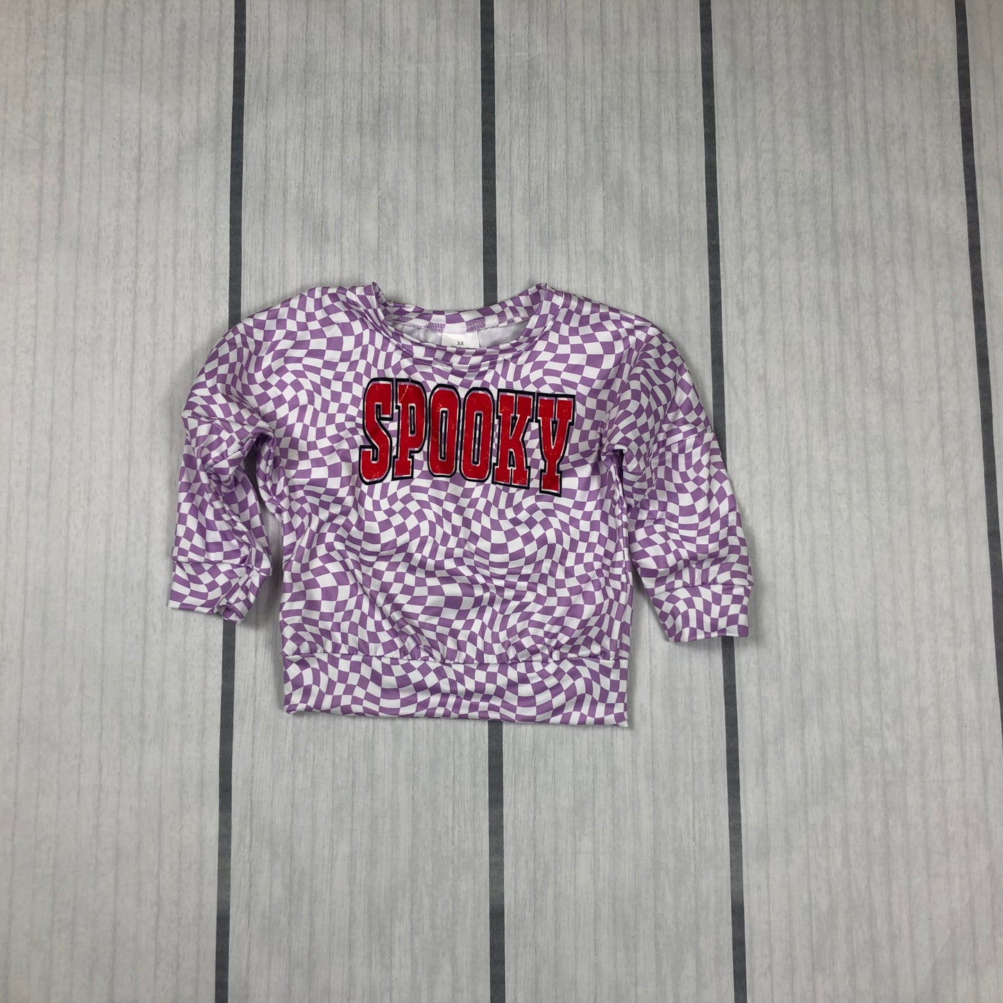 little girl purple checkered spooky pullovers