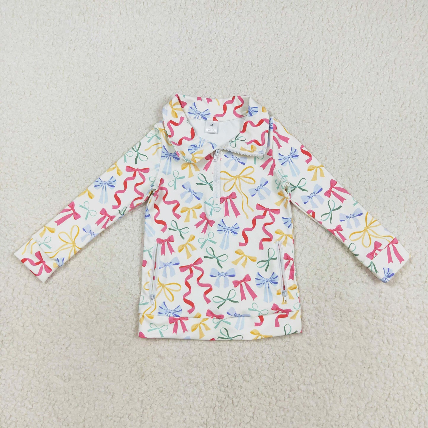 colorful bows on white athletic zip top