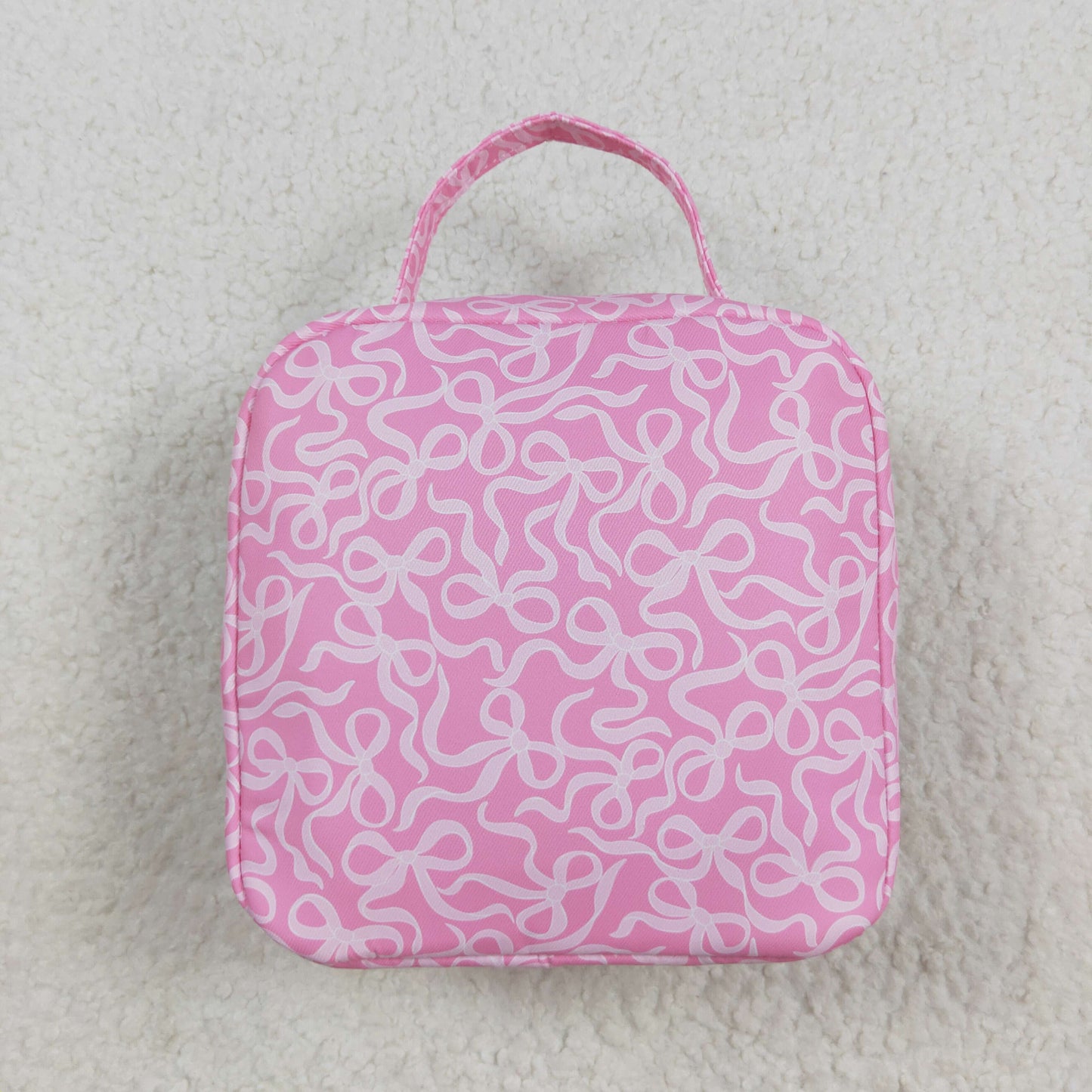white bow on pink kids lunch box